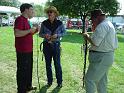 Paul Nolan working on a whip repair while chatting with Terry and Troy